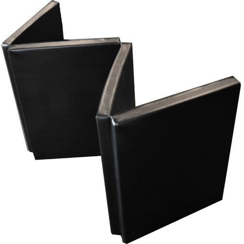 A black vinyl gym mat folded four times, showing its thick padding and compact design.